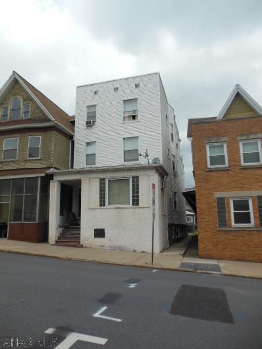 5 unit Commercial 3 story building with basement. Section 8(on 3) approved/fully occupied. An easy way to start your investment plan. Low taxes from reassessment 2017. "Hey!" even off street parking! It's time for you to invest here. Positive cash flows with your down payment. Have leases for approved buyers. (May have non-disclosure) Rubber & Shingle roof. Coin opperated Washer & Dryer. Trash dumpster $73/mo