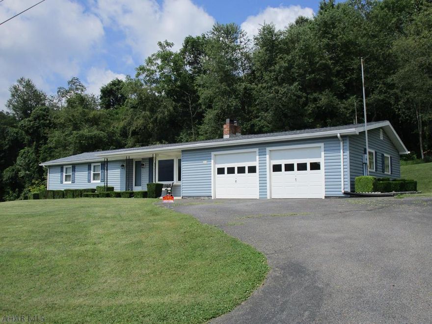 A LOT OF HOME FOR THE $$$$! Close to Snake Spring Park, hospital, schools, shopping...  Modular home (Gary Boor Home Sales); fireplace; ft.porch mountain views; private rr. patio; super-nice garage w/ interior basement entry; undergd. heat. fuel tank (driveway); updated items from 2013-2015+- include roof shingles, insulated vinyl siding, main-level windows, 2 overhead garage doors.   Septic system repaired/modified in 2012+- with township approval. Deed restrictions, covenants,...for Sunny Slope Terrace/H.C. Sleighter & Sons Subdiv. apply. DISHWASHER MAY NOT BE WORKING. NO FHA OR USDA/RURAL HOUSING LOANS.   GLA, AGE, SITE AREA APPROXIMATE - NO GUARANTEES.