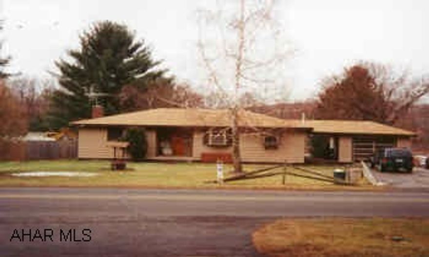 RANCH WITH BREEZEWAY AND GARAGE.