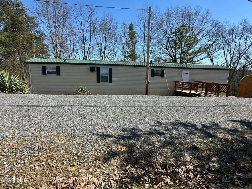 This home is situated on two acres located minutes from shopping and Lake Raystown.  It's so peaceful watching nature from your deck.  There are updates to this property including new roof and new drywall in the kitchen, living room and hall.  There are two sheds with electric and a 16X 12 rear deck.  Take a look for yourself.