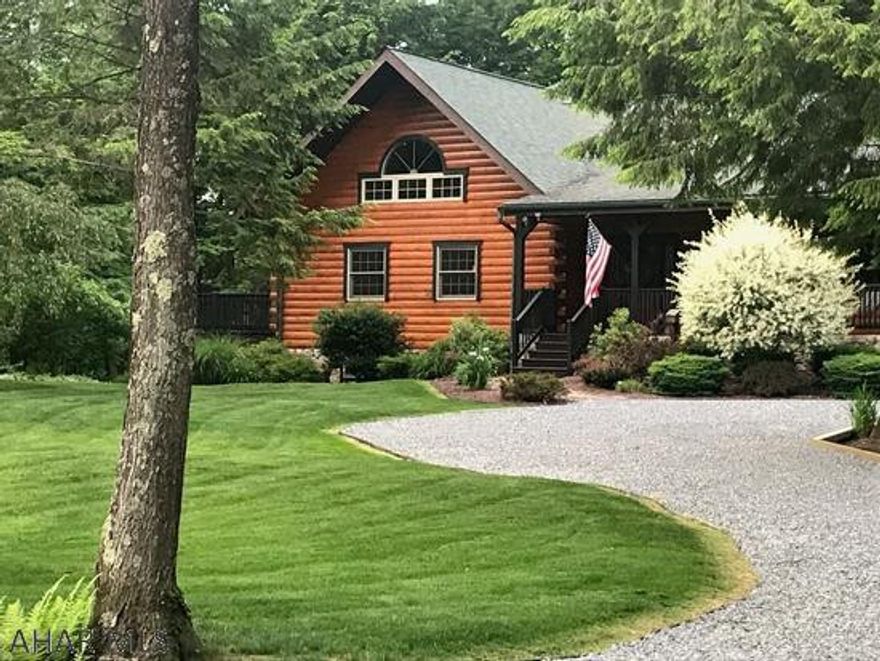 This home is one of a kind! 4 bdrm log home. Huge eat-in kitchen with hickory cabinets and center island, all brand new appliances included. Large living room with stone fireplace.. Loft could be a 5th bedroom or family room, front and large side porch and a oversized 2 car garage. Very quiet neighborhood, located in Central Cambria School District just minutes from town. This is a Must See Home!!!