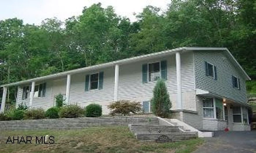 Spacious raised ranch with beautiful view of golf cours! Large pillared front porch, swimming pool with surrounding deck, and wooded private views! Spacious raised ranch with beautiful view of golf cours. Large pillared front porch, swimming pool with surrounding deck, and wooded private views from back porch. Holding Tank-FINANCING AVAILABLE TO QUALIFIED BUYERS.