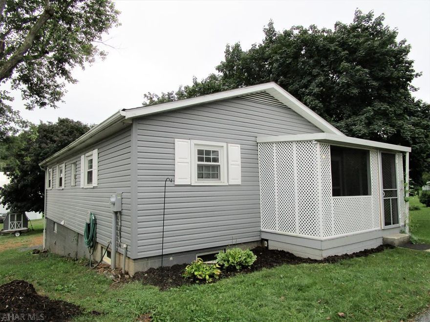 Charming rancher offering a living room, updated eat-in kitchen with hickory cabinets, light & airy family room with skylights & cathedral ceiling, two bedrooms and a full bath.  Walk-out basement with a full bath, bonus room that can be used as a third bedroom, and a large storage room that's finished.  Updated 200-ampere electric, heat pump with central air and an oil FA furnace. Replacement windows, blown in insulation in attic area and exterior home walls. Pleasant front screen porch for relaxing, side deck, private concrete sidewalk & macadam driveway.  Nicely located close to town and convenient to all supporting amenities.