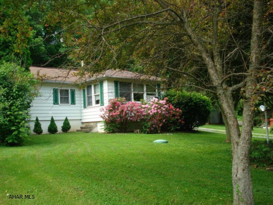 Charming and well maintained manufactured home on almost an acre of ground. Covered back patio, 3 outbuildings with electricity, 2 car garage with wood stove, electric dog fence. Dining room has built in china closets. Total Electric with Pellet stove back up in living room. Perfect for those looking to downsize or a getaway that is 1 mile from Canoe Creek.