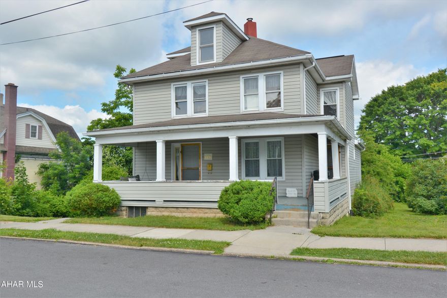 LOTS TO LOVE & LOADS OF POTENTIAL!  This 3-4 Bedroom | 2 Bath home is ready for it's next owner to add all their personal touches.  Starting with the wrap-around style porch you are sure to understand the possibilities this home possesses!  Upon entry is a large living room open to the kitchen area, which then leads to a back deck.  There is a private dining room and a 1st floor addition (that includes a shower, toilet & sink) that could be used as a bedroom or a host of other things.  Upstairs are 3 additional rooms & a full bath.  The basement ceilings are high & could be good storage.  The lot is another feature you are sure to love with extra space on either side of the home and out back, all on a quiet street.  Get your design wheels going & then call to see this one today!  Home sold AS-IS.