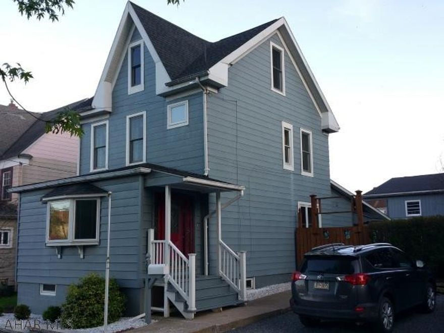 Must be seen. Well maintained 2 1/2 story, 3 bedroom home with modern kitchen and 2 full baths. Hardwood floors. 1st floor rec room. Finished 3rd floor. 1 car garage with workshop. Fenced yard.