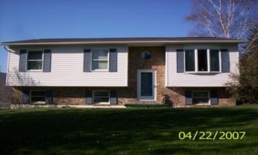 Great 5 bedroom 3 bath bi-level with new carpet, bar and laundry room with coal pellet stove, large new deck, on 1+acres. SR High School: Hollidaysburg Area. Large maintenance free deck. Large 18 gauge steel shed. Close to State Game Lands & State Park.  Coal stoker fireplace.