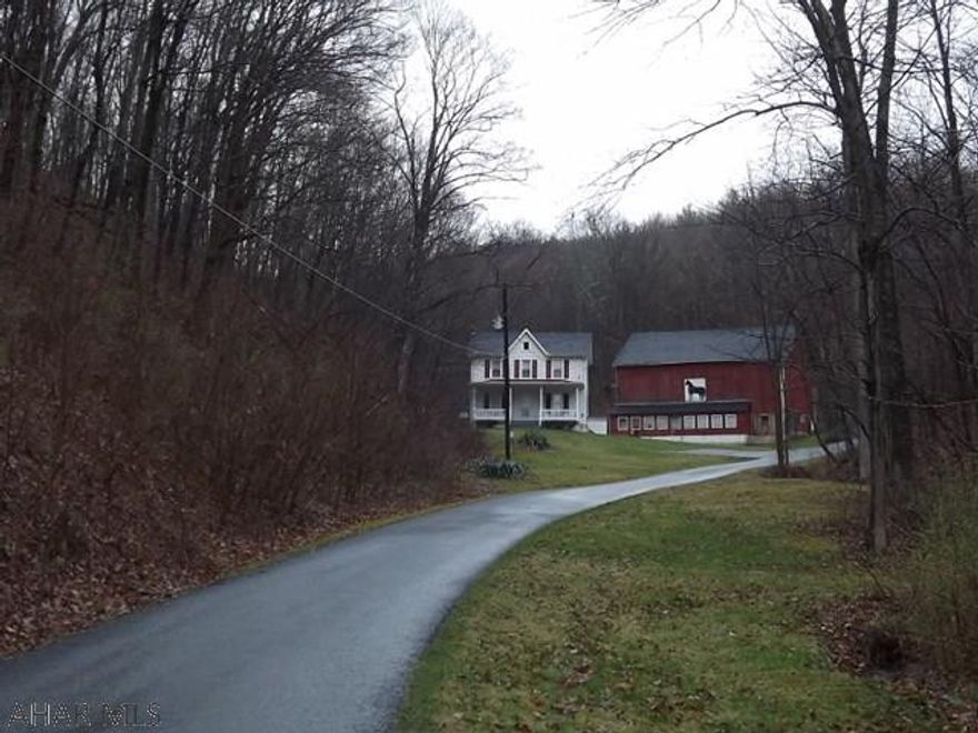 Quaint 3 bedroom, 2 bath farmhouse with a private setting and surrounded by 44 acres of woods. Formal dining room, eat-in kitchen, 2 covered porches, pocket doors, central air. Windows and storm doors replaced. 52'x42' bank barn, pavilion, stream, by Herline Covered Bridge. Area fishing, hiking, skiing and biking!