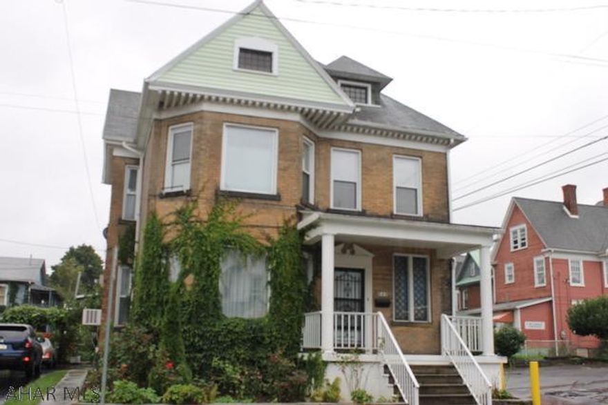 Beautiful, large brick 5 bedroom 1.5 bath home with detached garage is waiting for you! As you enter the foyer of this large brick beauty, on the 1st floor you will find the living room, family room with gas fireplace, 1/2 bath, large dining room with a 2nd gas fireplace (both have gas inserts but can be converted back to wood if preferred) and kitchen with convenient laundry area. Pocket doors separate the living room and family room. Wide staircase to the 2nd floor will take you to the 5 bedrooms and full bath. Two large rooms in the attic are easily accessed for great storage. New hot water tank, replacement windows, newer furnace, updated appliances and three car 20'7"x26'9" detached garage. Call today to schedule your appointment! Property being sold "AS IS".