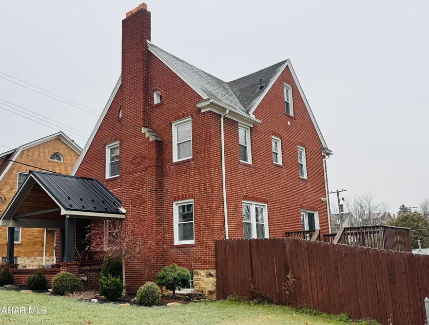 This charming brick beauty offers the perfect blend of character and charm with modern updates. Relax on the inviting covered front porch, complete with a swing and warm wood-planked ceiling that enhances the home's curb appeal.

Inside, you'll find:

3 spacious bedrooms
1.5 baths, including an updated full bath with all-new fixtures
Gorgeous hardwood flooring throughout
Large formal dining room with access to the deck
Bright and cozy breakfast nook with abundant windows—perfect for morning coffee or an indoor herb garden
Living room with a wood-burning fireplace for cozy evenings
Updated kitchen featuring quartz countertops, an island ideal for quick meals, and all appliances included The kitchen offers plenty of cabinets for all your storage needs. 
Convenient first-floor half bath for guests
Plenty of closet space
Third-floor walk-up attic, great for storage
Full basement for even more space and also provides great storage
Nice-sized deck overlooking the completely fenced lot
The attached two car garage an added plus!
Central air for year-round comfort!

This well maintained home is move-in ready and located in the desirable Calvert Hills area. Don't miss the chance to make it yours!
Call today to take a tour!