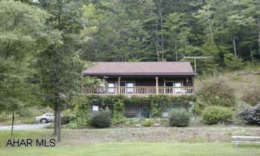 Owner needs 30 days after closing to move.  Wants to use garage for storage after closing, up to 6 months.  12 x 24 shed available. Subject to final subdivision approval of Snyder Township. Shared roadway.  Log type 1 1/2 Story home with finished lower level. Nearly 6 acres with woods and large pond.  Very private, easy access.  Oversized 2 car garage. Separate 12 x 24 shed with loft.