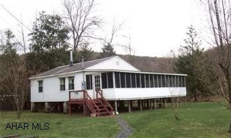 Well maintained cottage. Well maintained cottage, mostly furnished with woodburner, suitable for getaway or year round use. Large enclosed porch. Adjacent cottage available for $15,000 (second cottage being sold as-is)offers 225 feet of creek frontage. Sale price was for both cottages.