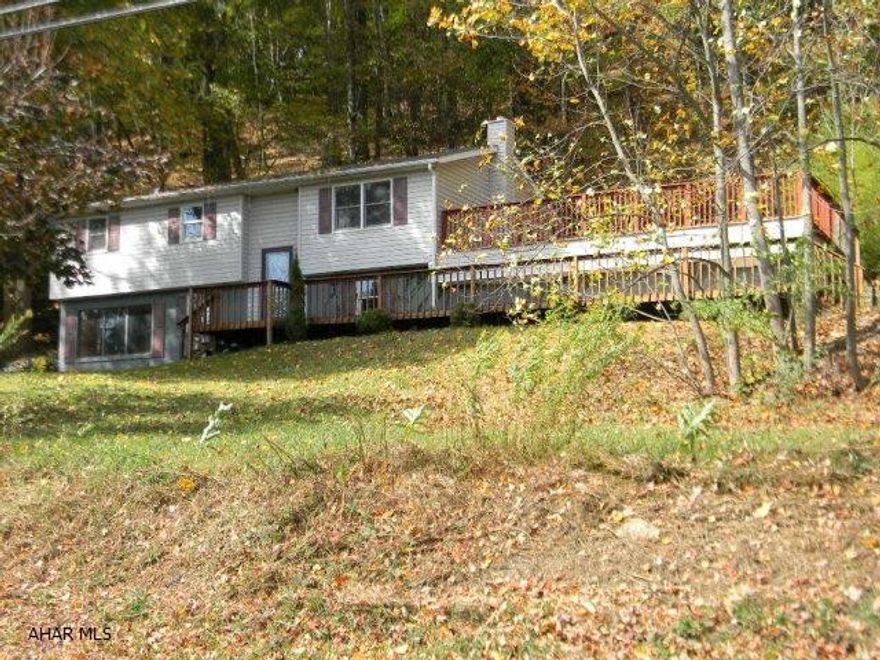 Well positioned 3 bedroom bi-level on 2 acre wooded lot with full finished basement and popular open floor plan with oak kitchen, dining and living room.