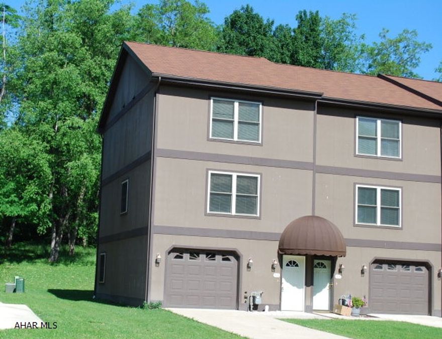 Beautiful end unit townhouse in move-in condition.  Neutral walls and carpeting. Ceramic tile entry hall. Third floor laundry in closet between bedrooms.  Cheery white kitchen, dining area with doors to deck, family room with doors to patio.  One car garage and off street parking for three cars in drive-way.  Great location close to mall and elementary school.  Flood insurance only $35.00 per month.