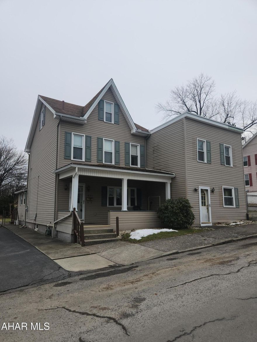 Spacious home with income potential!  Just moments from downtown Altoona you will find this unique property!  You will walk into a foyer with coat closet leading to two large rooms - living room and dining room.  Off the dining room there is a first floor half bath.  The sizeable kitchen has plenty of cabinet space room for eat-in possibility.  First floor laundry is located in its own space just off the kitchen.  The second floor has two large bedrooms, a full bath and attic that could be an additional bedroom!  Outside there is a deck for entertaining or relaxing, an above ground swimming pool and shed.  The yard is plenty big enough to enjoy being outdoors. Part of the uniqueness of this property is access to an attached 1 bedroom, 1 bath two story apartment with separate entrance. 
The apartment does need work.  Property is being sold AS-IS.