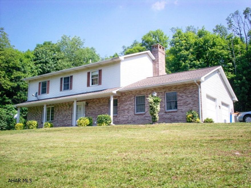 Well built vinyl/brick home on 7.2 acres.  4 BR/3 baths, oak kitchen, gas f/p in family room, first floor laundry. Lovely wooded setting just outside Pleasantville.