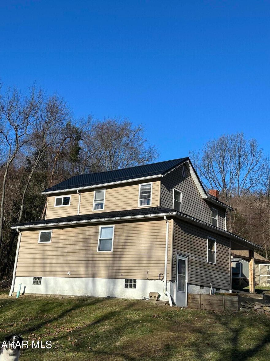 Beautiful remodeled home with many upgrades and custom features.  Upgrades include new metal roof, new windows, new flooring. A cooks dream- Custom maple kitchen with maple dovetailed drawers, under cabinet lighting and corian countertops, black stainless appliances and island.  The inviting living room features an electric fireplace with stone and a hardwood mantel. The main bedroom features a custom closet system, shiplap wall, projector with 100' screen and a  sliding barn door.  The luxurious bath has a walk in tile shower with bluetooth speaker, a jetted tub and custom maple vanity with corian countertop.