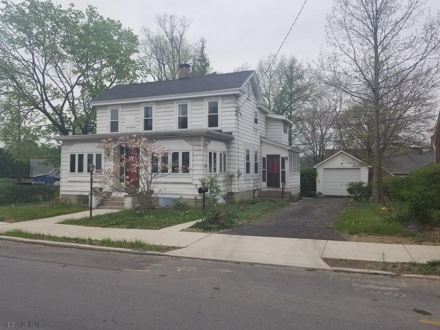 Very unique property in Hollidaysburg! The home sits on a corner lot that is .21 acres which fts a 1 car garage, off street parking and a large yard that makesyou forget you are in the borough!  The interior of the home is very unique, every room is accented in wood.  The 1st floor has 2 foyers, an office, a large family room, an EIK, DR and LR.  The natural light that is experienced throughout the home is amazing from the multitude of windows throughout the home. There are 3 BRs, a FB and storage room on the second floor.  In the basement there is plenty of storage room, a 1/2 bath and a 3 seasons room.  This room is below the deck and was used as a greenhouse by the previous owner.  The potentials are endless for this home and the beautiful lot that it sits on!
