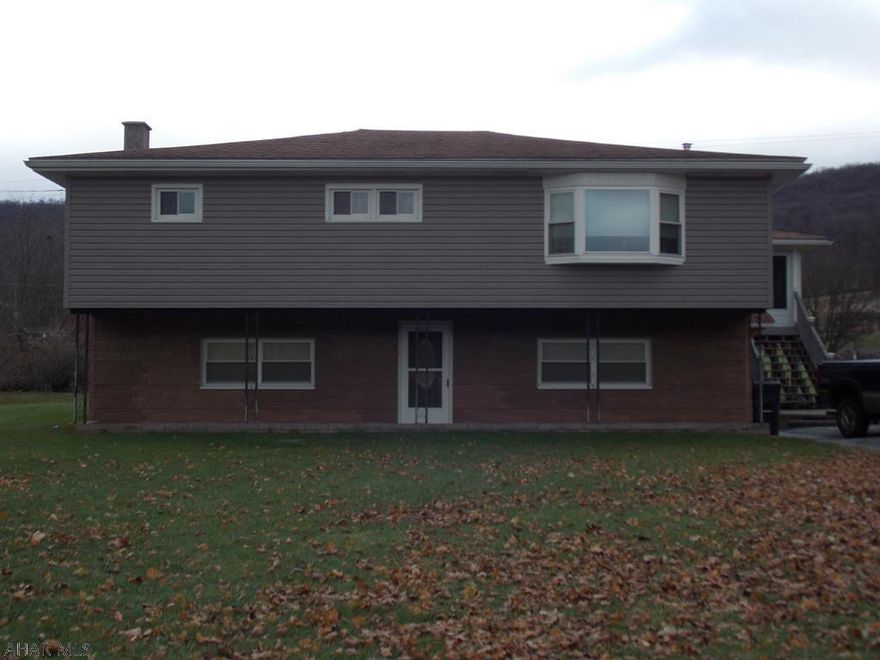Beautiful country setting for this home on over 2 acres. 3BR/2 bath raised ranch home with new windows, new furnace, new breaker box, new Water heater and a new huge screened in porch.  Totally maintenance  free, this deck is the perfect spot to spend summer days and nights. The view is priceless and free.  The 30x30 garage was used to do body work on cars. Seller is also leaving a new compressor for the buyer who may want to work in the garage. The 14x20 shed has lofts on both sides for extra storage. If you are looking for country living this is the house for you.  Give listing agent a call to take a tour.
