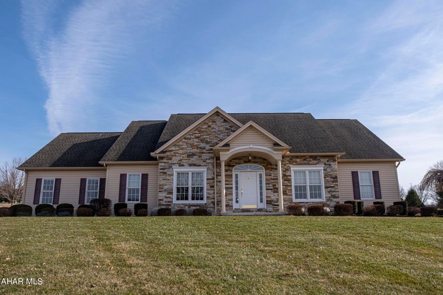 Beautiful, bright, warm and welcoming - those words perfectly describe this gorgeous home in Martinsburg. Located inside Mountainview Estates' prestigious 55+ community at The Village at Morrisons Cove, this lovely 2 bedroom,  3 bath home has everything you need to enjoy life to the fullest! Sit on either the front porch or back covered patio to enjoy Summer shade and warm evenings with beautiful views of the countryside. Inside, the impeccable style will make you immediately feel right at home. Immaculate hardwood floors take you past the dining room and separate sitting area into the main living room that features a cozy fireplace and lots of windows to let the light in. The living room opens into the kitchen and the two bedrooms are off to either side or the open floor plan, each with its own private bath offering tiled floors, double sinks, a shower and closet space. Downstairs you'll find a finished basement with two spacious rooms that could be used as an office, game room or whatever you wish! Lawn care and snow removal are included in a monthly fee along with trash removal and minor maintenance. There is also access to an on-call nurse! All you need to do is move in, relax and enjoy! Tour this home virtually with our online Matterport 3D walk through experience and professional video tour!