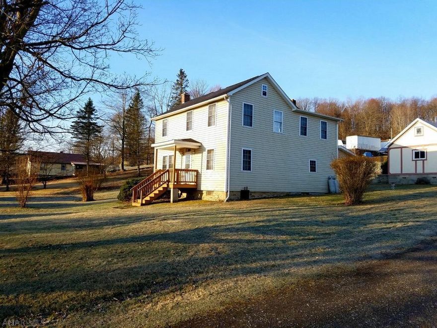 This large and completely renovated home sits on a large .89 acre corner lot.  Everything in this home has been replaced or renovated since 2008.  First floor has mud/laundry, bath, large and spacious eat in kitchen features a wood stove and an island, great for meal prep.  Kitchen also has walk-in pantry, and sliding glass doors.  Large living room and family room complete this floor.  Second floor features 3 bedrooms, one could be divided into 2, and spacious bath.  The home has 4 garage stalls, one building has 3, the single garage was used as a woodworking shop and has beautiful wood flooring, and electricity.  Plenty of room to entertain all of your family and friends inside and outside this home.