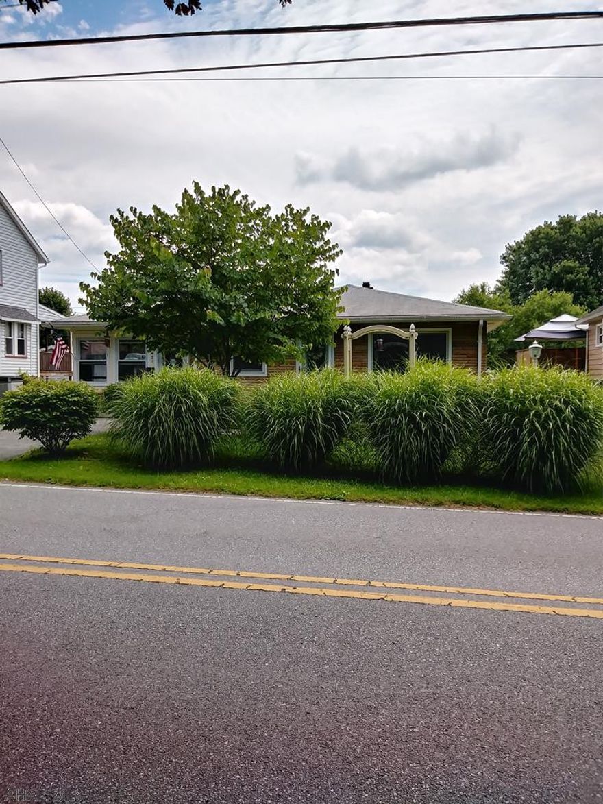 Nice ranch home with 3 large bedrooms and 2 full baths. Large eat in kitchen and tinted Bristol windows. Enjoy the 3 season porch and additional deck. Property includes a 1 car 12x24  garage , 16x12 carport and 10x16 shed for storage.  Handi -cap accessible Conveniently located and priced to sell.  Schedule your tour.