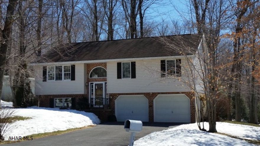 Nice vinyl-sided, 3 bedroom, 1.5 bath bi-level, covered deck, attached 2 car garage w/overhead doors, nice covered back deck.  #J-278