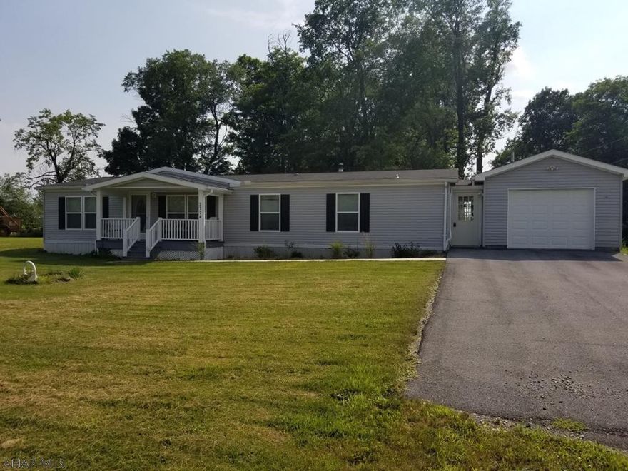 Just like new mobile home sitting on almost a 2 acre lot with beautiful views and privacy. Wide open spaces inside makes you really feel at home. Attached garage with breezeway makes for easy access directly into the house. This 5 year old home has so much to offer! You just need to come and see it for yourself. So call today for your tour.