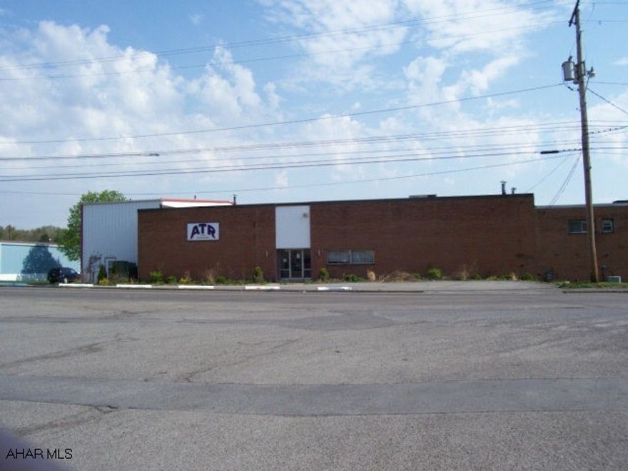 Includes large plot of land to the side and rear of building which could be developed.  Total land area is 6 acres.  Building is good quality with heavy wiring, loading docks and 2nd level offices.