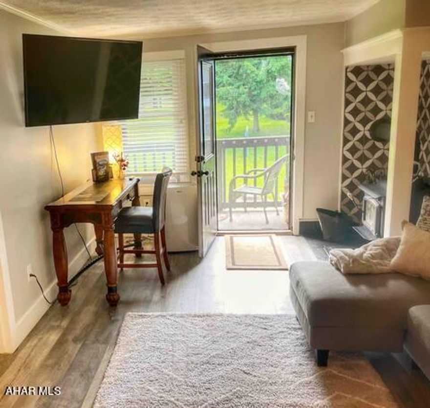 Very popular weekend and vacation getaway all year round - yet only moments from shopping, entertainment and other amenities.  Or consider this as an investment property.  New windows recently installed, new flooring and paint throughout, woodburning stove for extra cold evenings.  NOTE:  the living room couch and chair double as pullout beds. HOA provides access to indoor and outdoor pools, tennis courts, restaurant, access to hiking trails and coin operated laundry.  Free onsite parking.  Additional internal amenities - ring doorbell, smart lock and WIFi thermostats.