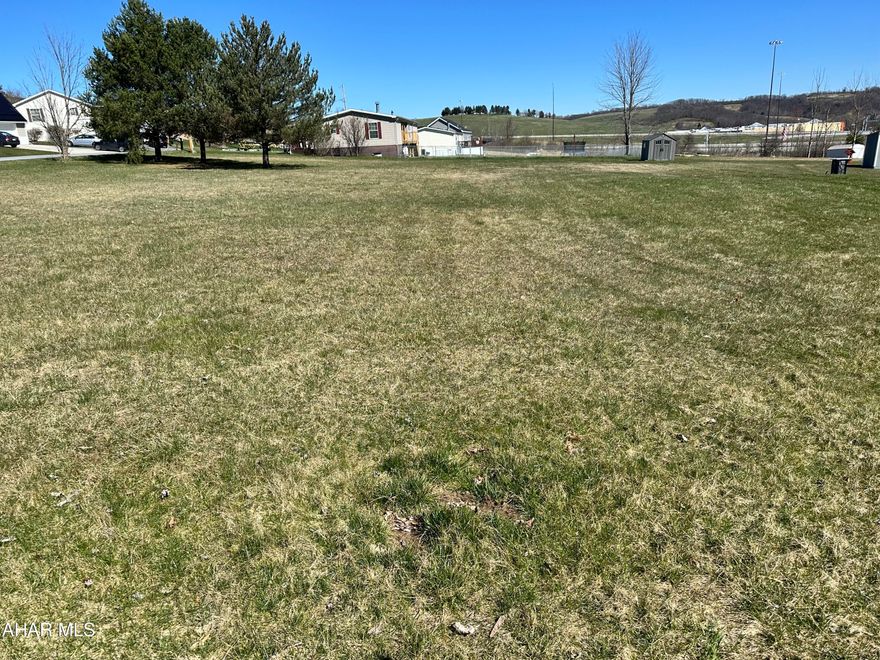 East Freedom building lot, 2 parcels have just been combined to make a .685 parcel. Recent survey on hand. Property will need a private well drilled and connected to public sewer, sellers have this parcel grandfathered into a 1500.00 sewer tap fee with Freedom Township.