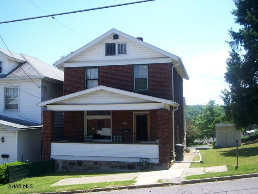 2Br home with original woodwork and hardwood floors on a double lot in a quiet neighborhood. Kitchen and bath need updating. Rear, off-street parking for at least 2 cars in addition to the one-car garage.