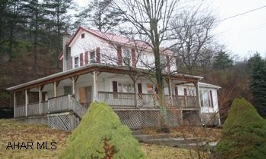 Countryside Farmette with 29.96 acres surrounded by mountains. Countryside Farmette with 29.96 acres surrounded by mountains. 2-Story vinyl house has 3BR/1BA. Master BR is on 1st floor. Kitchen has pass thru to DR; laundry off kitchen, spacious Family Room w/cedar walls & beams. Large wraparound porch, open back deck.  *2-story barn w/5 horse stalls, plank floors, electricity; heated tack room; open front machine shed; 18'x24' building w/storage and corncrib on side w/attached work shop. Acreage includes pasture and woodland and pond, some fencing. Ideal for horse lovers! Home Warranty Included.