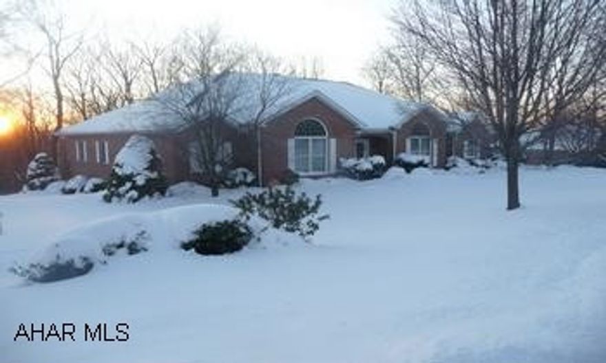 Upscale, custom built, 4BR/4BA brick/vinyl ranch home in Sylvan East Development. Upscale, like new, custom built 4BR/4BA brick/vinyl home in prestigious Sylvan East Development. This spacious (over 5000 sq ft finished space) impressive home features an elegant foyer, formal LR & DR, GREAT ROOM W/GAS FP, custom cherry kitchen w/breakfast bar, MSTR SUITE BR/BA & 1st floor LR. A finished, walkout basement offers FR w/gas fireplace and wet bar, game room, office, exercise room, craft room, BR and utility room. The home also offers a 2 car attached garage, 1 car int. garage, patio, lanai and large rear deck. Listing agent is brother to owner. HOME WARANTY INCLUDED.