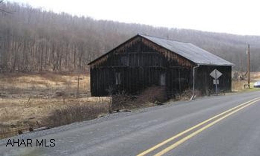 29 x 50 Bank Barn with Electric, plus 23.63 acres and a stream. Approx 10 acres open, the rest wooded.