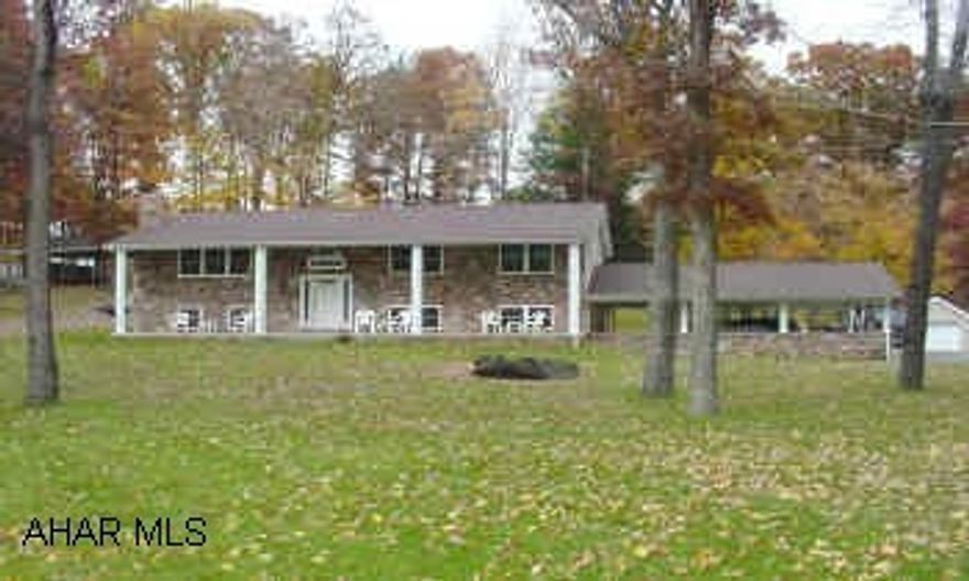 Nice Vinyl Sided Stone Faced Split Entry on 1.47 Acres +/- in Frosty Hollow Area.  The entire dwelling has been remodeled with new windows, new doors, new deck, carport, stone faced front, new pillars, siding and soffit, 2 fireplaces, 2 full baths and 3 bedrooms -- finished basement  with kitchen, family room with stone fireplace, walk-in pantry,  2 bedrooms,  and one bath.  GREAT OPPORTUNITY -- NICE COUNTRY SETTING