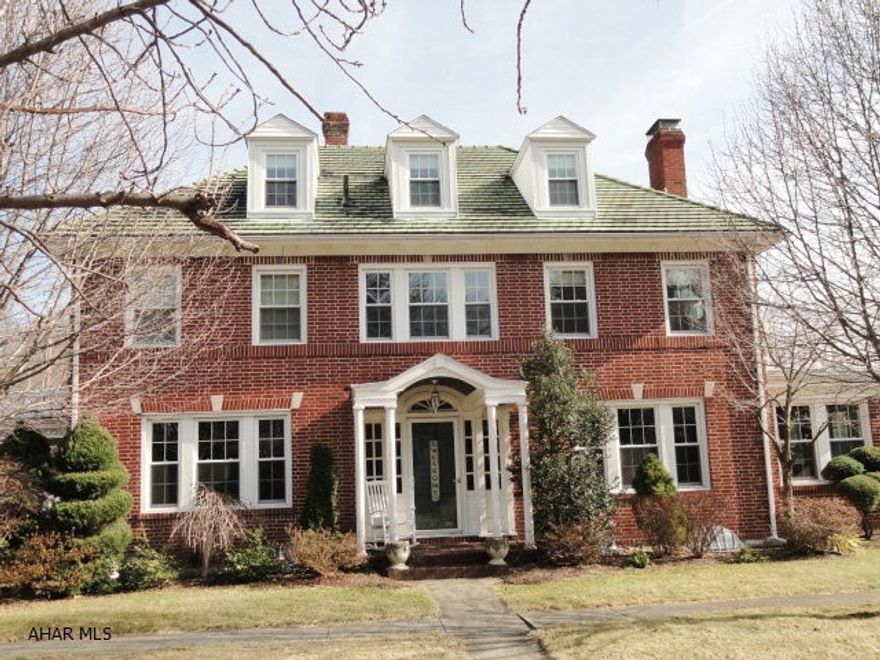 Mansion Park classic brick 3 story w/tile roof. Original woodwork/hardwood flooring. Updated cherry kitchen with top of the line Kitchenaid stainless appliances, granite, and heated tile flooring; large living room & dining room, beautiful foyer with open staircase to 3rd floor, bright sunroom, 3 fireplaces, 5 bedrooms including master w/sitting room and 2nd floor deck. Office/study w/French doors, 2.5 baths, basement family room with fully equipped bar and stairs to outside deck.  51 new insulated windows w/screens. One car attached garage and fenced in yard (6' privacy fence). Wonderful family neighborhood in a prestigious area of Altoona. A stunning piece of architecture and a wonderful property to call home!  Download more information under other documents.