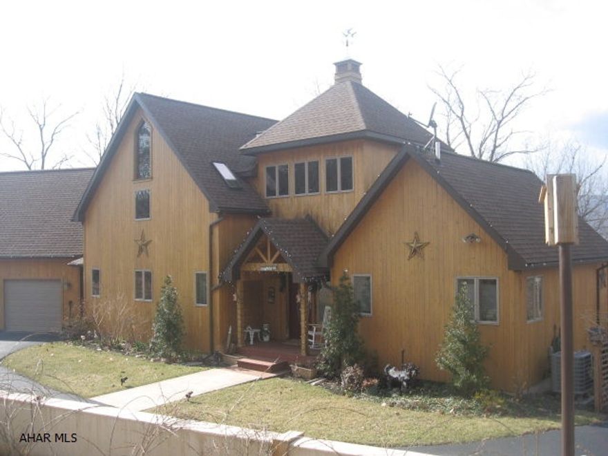 Exceptional cedar home on 1.17 acres!! Very creative floor plan w/the right side of the home being the Master Bedroom & Bath. The middle is 'The Tower' -a beautiful front porch area & foyer from the front to the back; 2 open staircases.  Awesome windows around tower; features sitting area. Left side of home is main level of LR, DR, Kitchen; the upstairs bedrooms & loft; the lower family room. The LR is irregular w/stone FP, diagonal T&G pine on wall & around windows to the 2nd story. DR is angled w/big windows and shelving. Kitchen has different heights & depths of cabs; granite countertops. BR & Baths are all creative w/vaulted ceilings and/or angled walls. Pool room, TV area, pellet stove, 3/4 bath & workshop downstairs.  3-car garage & shed. Natural landscaping w/massive retaining wall!