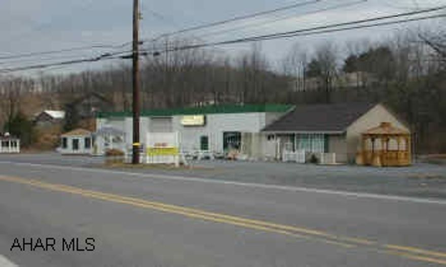 Concrete block building with 2 garage bays and office space.