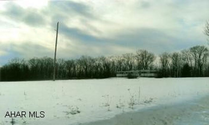 11 acres with an old single wide trailer (1972) on property. 11 acres with an old single wide trailer (1972) in property. Great views, newly surveyed, 7 acres wooded, 4 acres cleared.