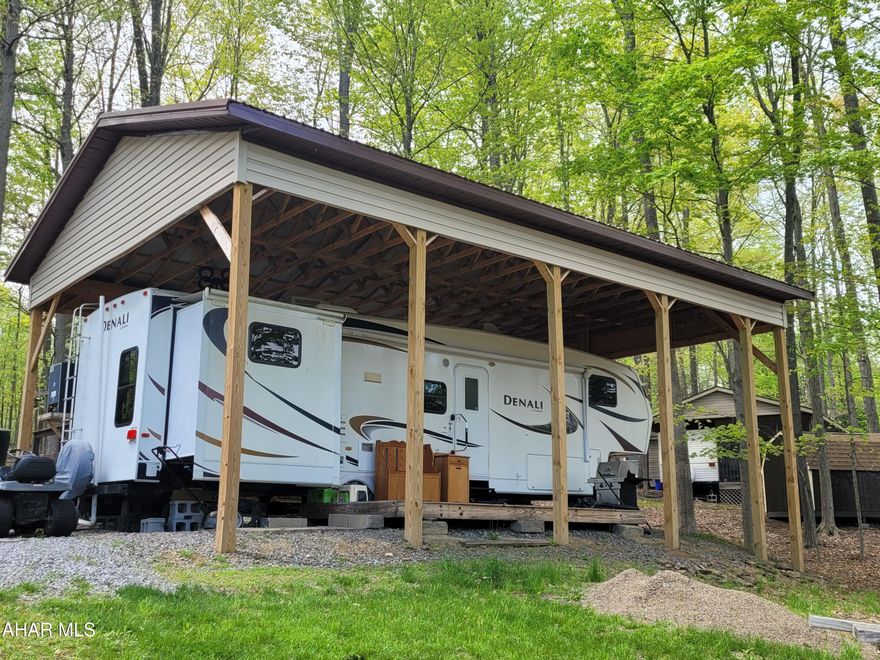 Two bedroom, 1.5 bath spacious camper with slideouts protected under a pavilion.  Location is what you will appreciate with this unit as it is directly next to a wooded area.  There is plenty of sleeping space for all.  Very few campers offer two bathrooms which makes this property stand out.