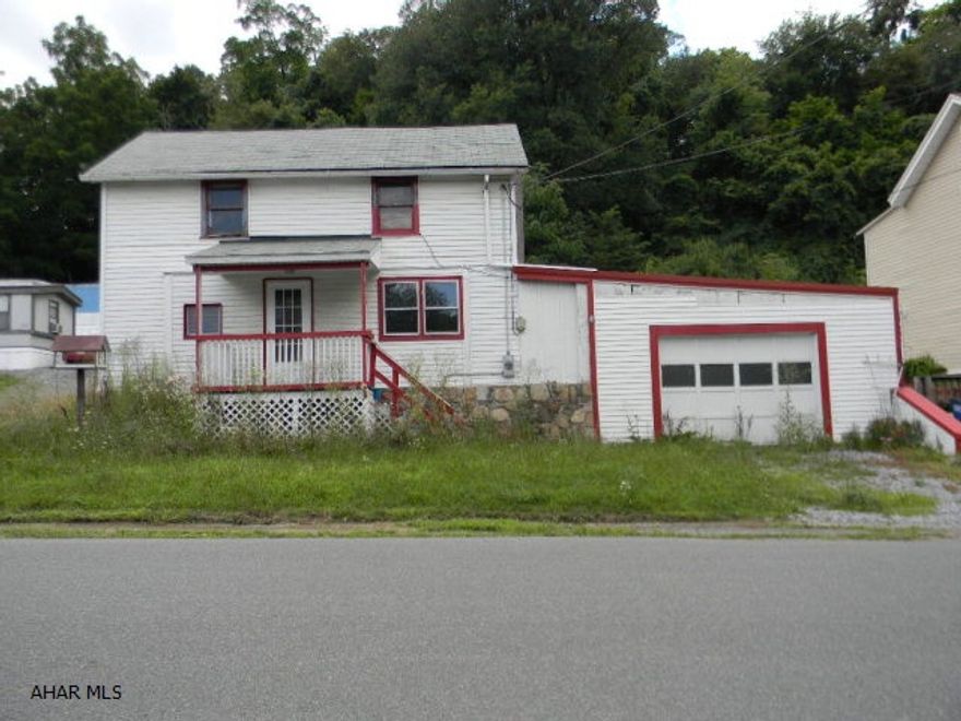 Two-story vinyl, 2 BR/1.5 BA w/ 1 car attached garage. Can be used as duplex or single family residence. Offered AS IS condition. Good investment opportunity!!