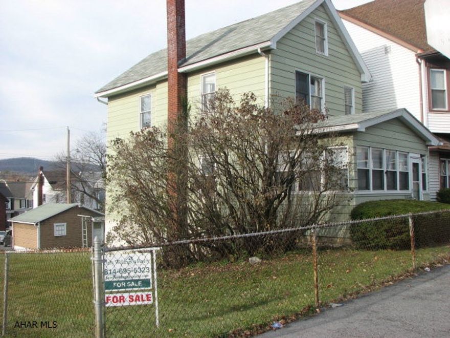 This could be a very cute house with some TLC.  Spacious, fenced, double corner lot and two car garage include off street parking.  A large enclosed front porch offers first floor laundry facilities or an additional bonus room.  Lots of storage in the dining area with the built in hutches and book cases. Hardwood under carpeting.  Includes A.H.S one year home warranty and blower motor on furnace as just replaced November 2012.