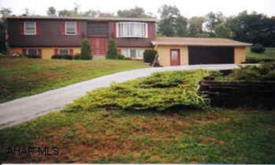 What a view...lower level offers 2 family rooms and office, oil heat and electric heat pump.  Covered patio, 30x30 2 car garage.