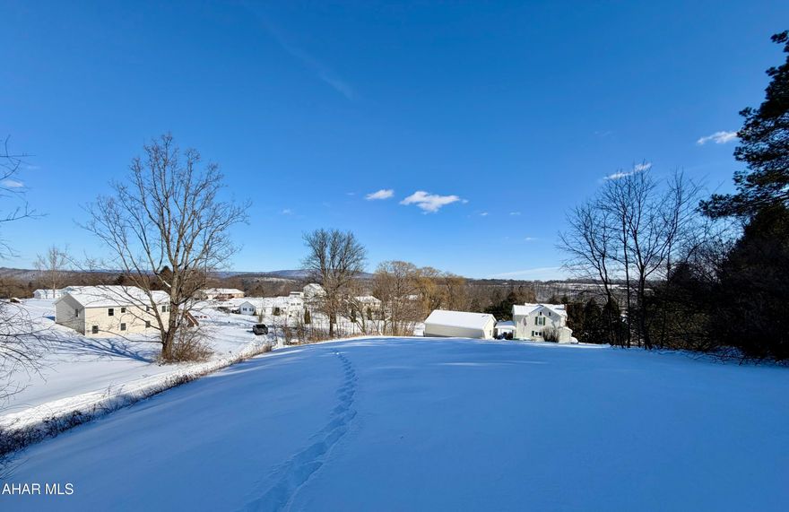 Desirable building lot with a view! Public water and sewer are available at the property line, making it a convenient lot to build your dream home on.