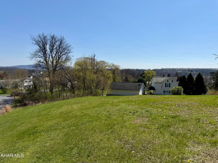 Desirable building lot with a view! Public water and sewer are available at the property line, making it a convenient lot to build your dream home on.
