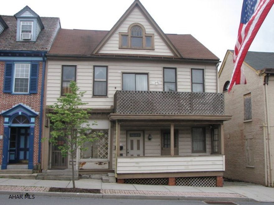 1 store front plus 2 1 bedroom apts. Ample parking in rear. Being sold As Is.