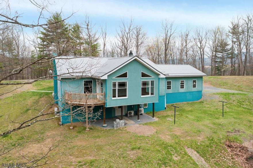 Ultimate in Privacy.  Delightful ranch tucked away on 53.12 secluded mature wooded acres with endless views.  Home highlights include an open floor plan with a bright & cheery sunroom, floor to ceiling windows allowing an abundance of natural light, luxury vinyl plank floor & a coal/wood stove.  Living room with luxury vinyl plank floor & spacious eat-in kitchen with laminate floor.  First floor owner bedroom with private full bath plus another bedroom & another full bath (both baths have radiant floor heat).  The finished walk-out basements boasts a half bath, laundry & an additional bedroom with a walk-in closet.  There is an attached 2 car garage as well as a detached 1 car garage.  Relax or entertain in the 16x30 in-ground heated salt water pool.  All gas, oil & mineral rights included