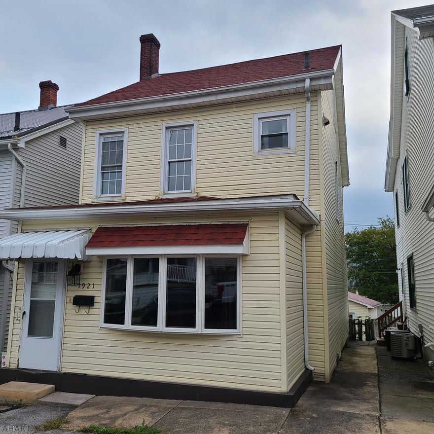 Vinyl-sided 2 story home with a finished attic (no heat); a detached over-sized garage; newer roof & windows; updated electric; eat-in kitchen with tiled floor; 1st floor laundry room; 1st floor 1/2 bath; and a large deck.