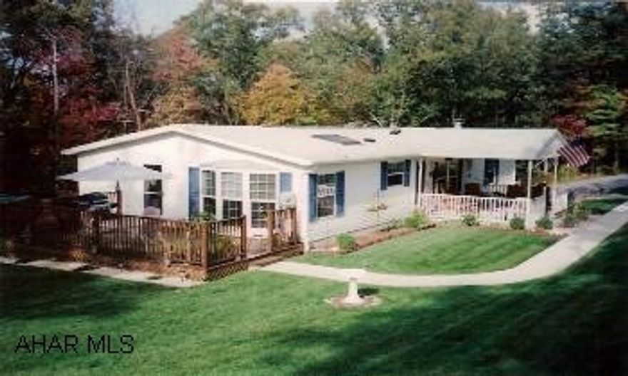 Nice 3BR/2.5 BA Ranch Doublewide on 2+acres. Tree Shaded lot. Home includes beautiful oak kitchen w/island, skylight, bay window & appliances. Also includes Master suite w/bath & walk-in closet, living room w/fireplace, covered porch, deck. Property also includes a cute 2BR wood frame cottage. This listing agreement is contingent on the seller(s) subdivision of 2+ acres from their current 22 acres.